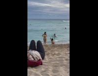 Woman yellow bikini beach shore photoshoot