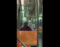Storm trooper sits on train 