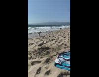 Guy blue shorts jump over guy sand