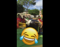 two girls fall slow motion off mechanical bull