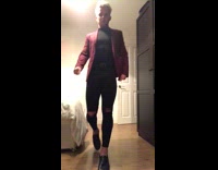 Guy throws red jacket onto lamp 