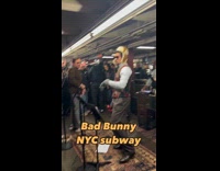 Crowd jamming to bad bunny performing on subway station