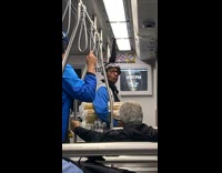 Guy with standing pony hair in train