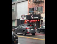 Man beg change with cup on pole