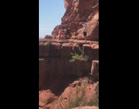 Girl in Pink Tries to do Headstand for Photo