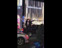 Guys dance on black truck with menorah 