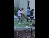 2 Couples dance on rooftop 