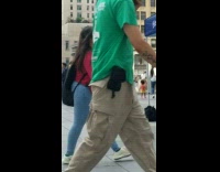 Mother red shirt pose on pole baby on trolley