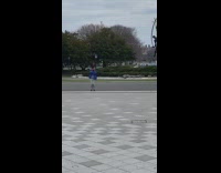 man in blue jacket dances and skates