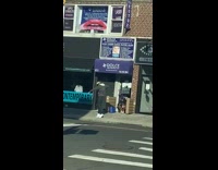 Guy Dances and Kicks on Sidewalk 