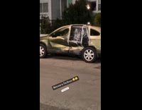 Collab WINY - Parked wrecked car with taped door night