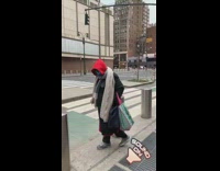 Person dances to Frank Sinatra song outside 