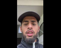 Immature black hat jacket guy makes face 