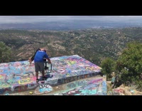 Man workout video shoot graffiti mountain view