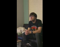 Lady Questions  Husband and Cat Looks at Him