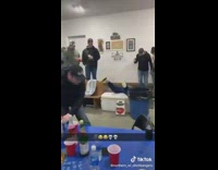 Guy booty bumps girl falls over cooler