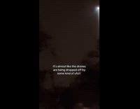 Man filming strange drones flying over cemetery