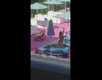 Woman bikini kneel raise arm round bed