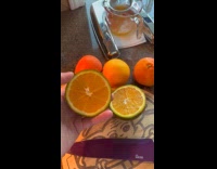 Filmer show sliced orange with green peels