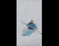 Guy rides kayak down mountain 