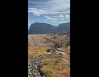 Brown skirt girl poses off trail mountain 