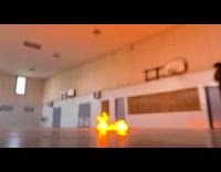 Teacher demonstrates a balloon explosion at school