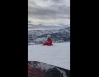 Woman fur hat red cloth snow mountain naked men