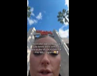 Woman wearing tennis dress on rollercoaster 