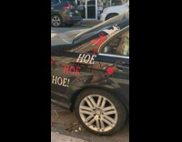 Car with decals that say hoe hoe hoe