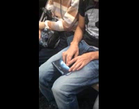 Guy closes eyes and plays drums beat tap game on subway train