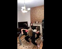 Four friends bend backwards onto each other 
