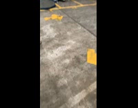 Man lie down on the forklift while in reverse at the factory