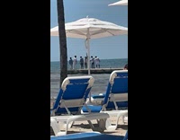 Men group jump shot at beach docks