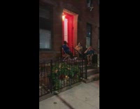 People watch tv on front door steps