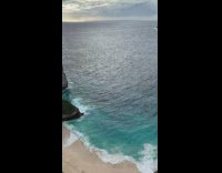 Collab KaleSaladIG - Guy stands on cliff and looks at beautiful beach view and sees send nudes in sand