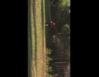 Red Shirt Guy Tries to Jump Motorcycle Dirt Ramp and Falls In Grass