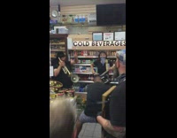 Two guys dance off bodega instruments trumpet 