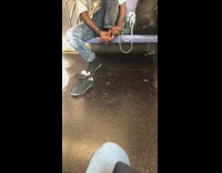 Man takes off black Fila shoes and clips toe nails with nail clippers