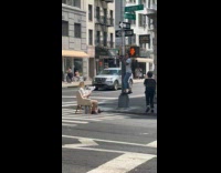 Collab IITW - Woman sit chair read newspaper on street
