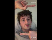 Grey shirt guy blinks one eye quickly 