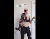 Girl turns up in kitchen with cat