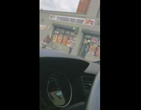 Guy punches the air and dances in front of store, construction worker gives him change