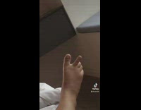 Person does peace sign with feet 