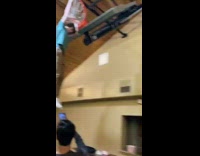 Guy hang on the basketball ring in court at school 