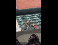Woman poses with ice cream baseball hat