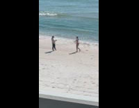 Woman red bikini ballet dance at beach