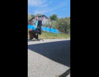 Girl rolls across asphalt chair brown sheep