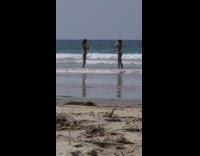 Woman orange bikini beach photoshoot then kids blocked them