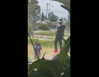 Guy white bandana vest sing over rock