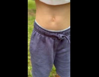 Kid shows growling stomach after drinking juice